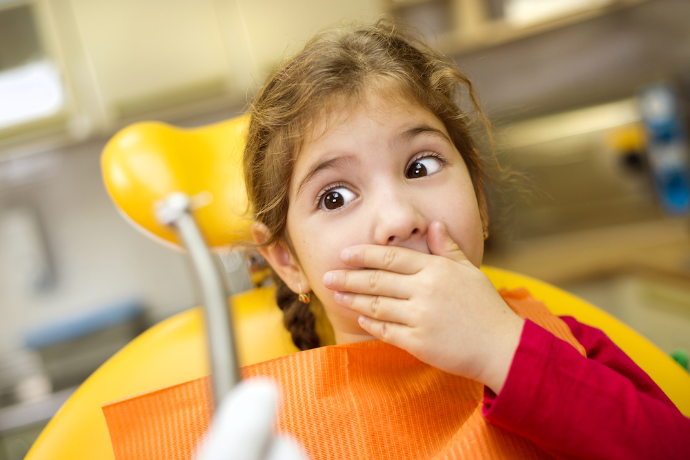 Criança com medo de dentista